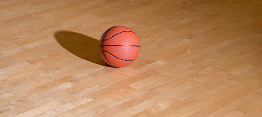 Basketball on hardwood court floor with lighting. Workout online concept. Horizontal sport theme poster, greeting cards, headers, website and app