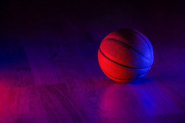 Basketball ball isolated on dark background. Blue neon banner. Horizontal sport theme poster, greeting cards, headers, website and app © Augustas Cetkauskas