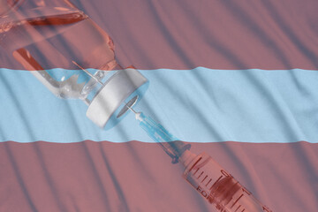 Corona virus vaccine and Austria flag, Vaccines and syringes on a light blue background