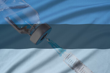 Corona virus vaccine and Estonia flag, Vaccines and syringes on a light blue background