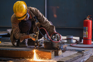 Portable automated gas cutting system. The operator controls the automated gas cutter.