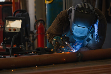 Welding of metal structures by semi-automatic arc welding. MIG welding.