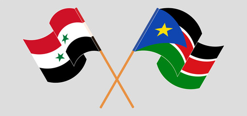 Crossed and waving flags of Syria and South Sudan