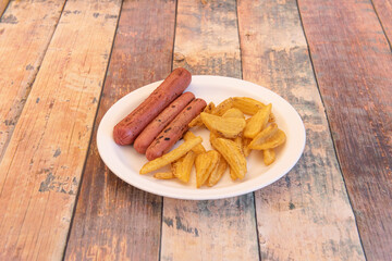 Salchipapa or salchipapas is a fast food consisting of fried slices of sausage and French fries, consumed as street food in Latin America