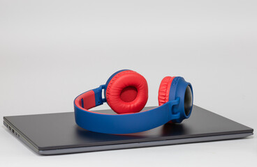 Headphones and laptop isolated on the white background