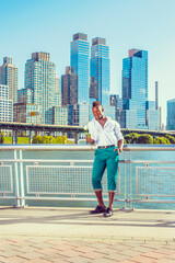 Missing You. Wearing white shirt,  green pants, leather shoes, a young black guy with mohawk hair...