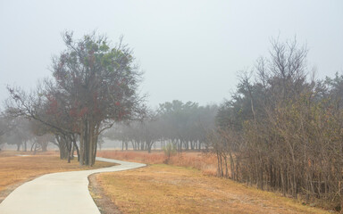 Brownwood Texas walking trail festival park, during foggy mourning, relaxing panorama view, recreation area.