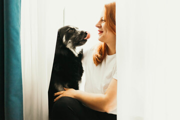 girl and black dog enjoying time 