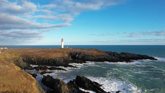 Red and white lighthouse on a beautiful day - Powered by Adobe