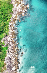 Overhead aerial view of Seychelles Beach with rocks, ocean landscape