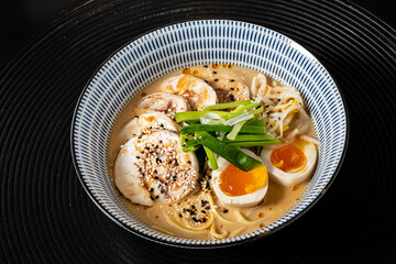 Japanese ramen soup with chicken, egg and green onion