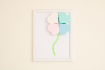 Four heart shaped face wash cleansing sponges in white paper card frame. Creative copy space layout. Flat lay pastel background. Love concept.