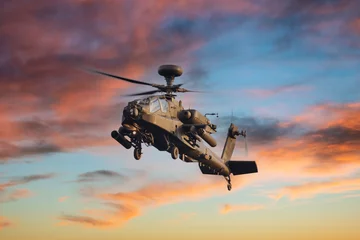 Foto auf Acrylglas Hubschrauber Apache attack helicopter flying in the sunset sky