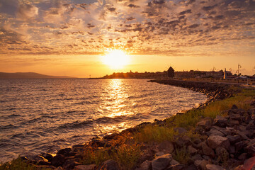 Seaside landscape - view of the Old Town of Nessebar in the rays of the rising sun, on the Black Sea coast of Bulgaria