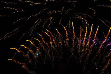 Very beautiful fireworks against the black sky. Graphic resource for design. Underlay or undercoat