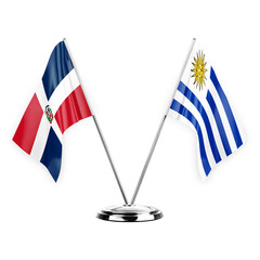 Two table flags isolated on white background 3d illustration, dominican republic and uruguay