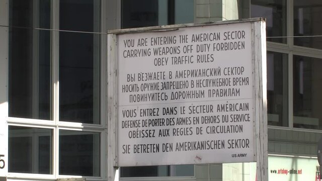 Sign near former border crossing Checkpoint Charlie in Berlin, Germany