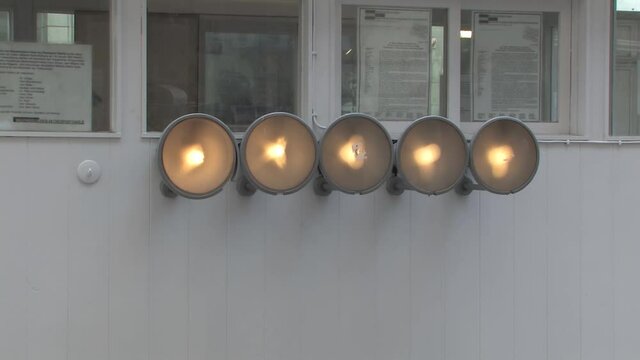Close up of spotlights on former border crossing Checkpoint Charlie in Berlin, Germany