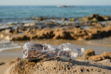 Plastic bottle discarded on pollution contaminated sea ecosystem, environment waste