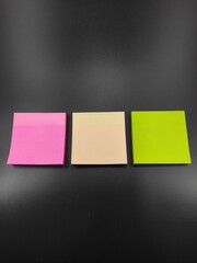 Photo of multicolored paper notes isolated on black background, Not Focus
