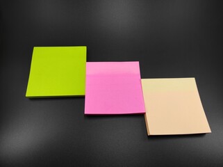 Photo of multicolored paper notes isolated on black background, Not Focus