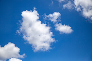 Typical white clouds with cotton texture on a blue sky background
