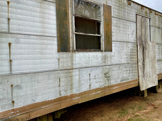 Old creepy scary abandoned building damaged mobile home