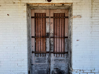 Old creepy scary abandoned building bars on doors