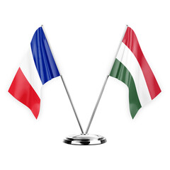 Two table flags isolated on white background 3d illustration, france and hungary