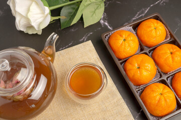 Chinese Bean Cake, sweet dessert in orange shaped stuffed with beans and egg yolks served with hot...