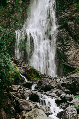 Fototapeta na wymiar new zealand waterfalls and mountains