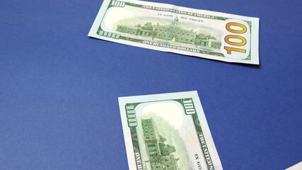 Falling dollar bills. The concept of investment, success, financial prospects or career growth.The video can be used in selling, expenses, usd, stack, closeup, accounting, growth, bills, buy, usa, deb
