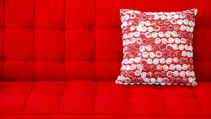 Closeup studio shot of white circle knitted pattern soft backrest cushion scatter pillow placed on...