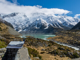 Fototapeta na wymiar Glacial Lake on the Hooker Valley Track in summer with snowy mountain range to Mt Cook New Zealand