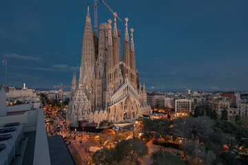 Sagrada Familia basilica in Barcelona. The Antoni Gaudi masterpiece has become a UNESCO World Heritage Site in 1984.  - obrazy, fototapety, plakaty