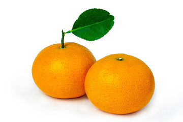 Two mandarins with green leaves on white background