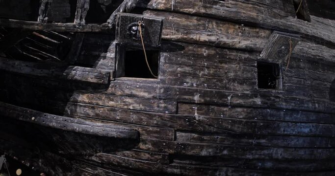Close up view of spots where cannons were installed in the wrecked swedish warship Vasa built during 1626 in 1628, located in Vasa museum, Stockholm, Sweden. 4K video.