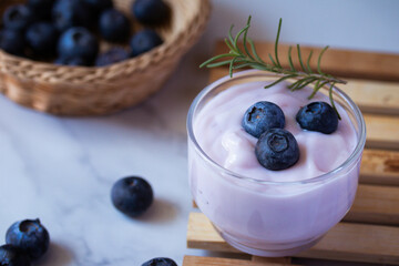 Fresh blueberry yogurt in a clear glass