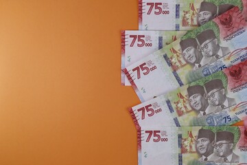 Rupiah the official currency of Indonesia. Business and finance concept. Uang 75000 Rupiah. Bank Indonesia. Copy space, Negative space.