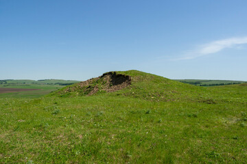 An ancient buried mound. Grave Hill. Historical landmark.