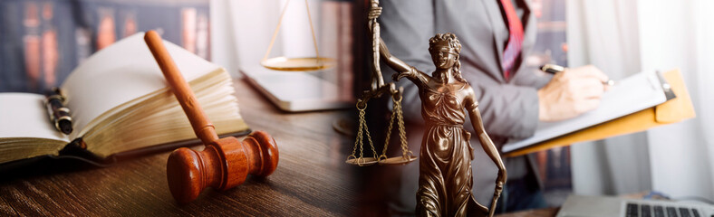 Justice and Law concept. Legal counsel presents to the client a signed contract with gavel and...