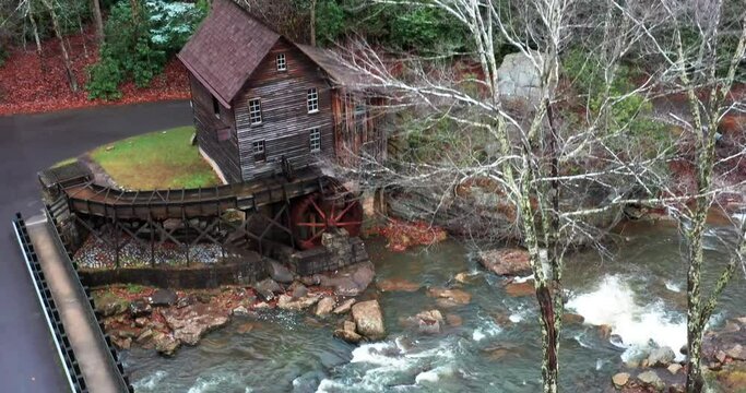 Glade Creek Grist Mill in West Virginia with bridge and drone video moving up.
