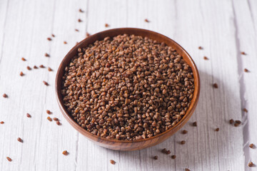 dry buckwheat on  wood background.
