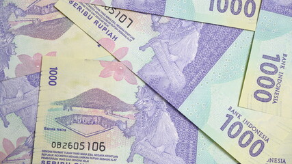 Rupiah the official currency of Indonesia. Business and finance concept. Uang 1000 Rupiah. Bank Indonesia. 