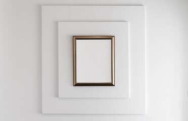 Wooden frame with blank white copy space area on a white wall