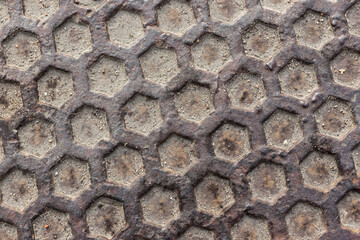 Old grungy metal flooring with hexagonal texture. Industrial pattern