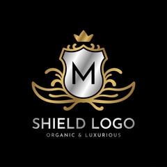 letter M shield gold and silver luxury vector logo design