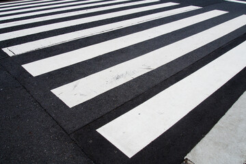 pedestrian crossing, white stripes on black asphalt, road markings zebra crossing, place to cross the road, traffic rules