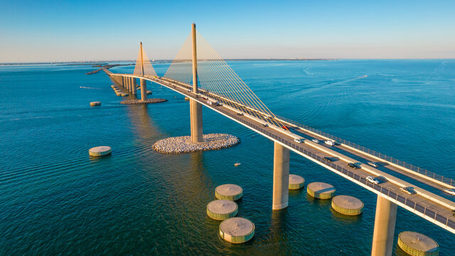 Sunshine Skyway Bridge spanning the Lower Tampa Bay and connecting Terra Ceia to St. Petersburg, Florida, USA. Day photo. Ocean or Gulf of Mexico seascape. Reinforced concrete bridge structure.
