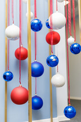 Christmas balls are hung on ribbons. Celebrating new year, christmas